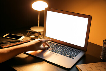 Woman using laptop at home late in evening, closeup