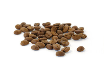 Coffee beans are pouring into a white background.