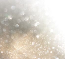 abstract glitter silver and gild lights background. de-focused