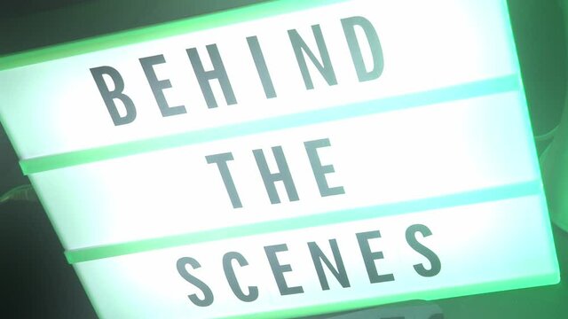 Behind the scenes lightbox in studio. letterboard text lightbox. Color light changing. Cinema Light box beside movie slate clapperboard megaphone and director chair. video production Behind the scenes