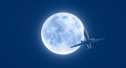 Passenger airplane in the sky on the background full moon at sunset "Elements of this image furnished by NASA"
