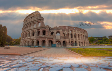 Fototapeta na wymiar View of Colosseum in Rome and morning sun - Rome Colosseum is one of the main attractions of Rome