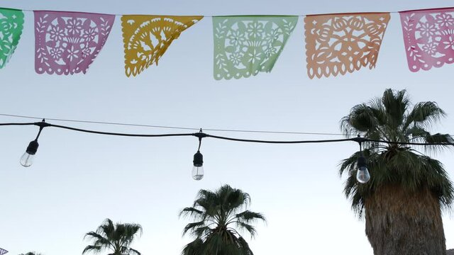 Mexican perforated papel picado banner, festival flags, paper tissue garland. Colorful hispanic folk carved street decor for fiesta, holiday or carnival in Latin America, Day of Dead or Dia De Muertos