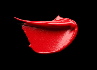 Red lipstick stroke isolated on black background