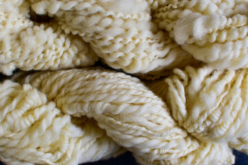 full frame background of natural sheep's wool yarn 