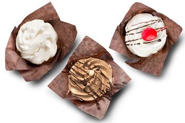 Three cupcakes on white