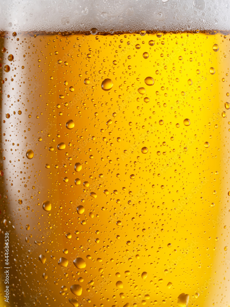 Canvas Prints Cooled glass of beer close-up.  Small water drops on cold surface of beer glass.