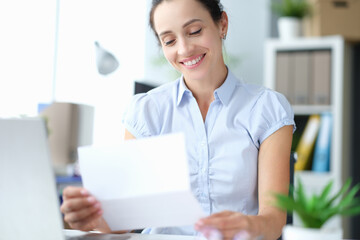 Happy millennial girl site feel excited reading good news in postal paperwork letter