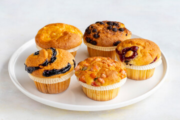 Muffins. Assortment of muffins on a white background.