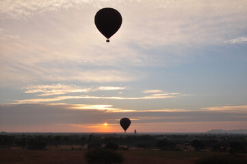 View cityscape of Bagan or Pagan ancient city and landscape UNESCO World Heritage Site and balloon flying bring travelers people looking aerial view on February 2, 2013 in Mandalay, Myanmar or Burma