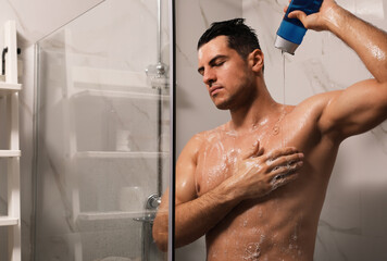Man using gel in shower at home
