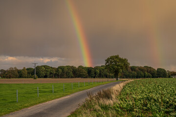 Rainclouds and a rainbow near Retelitz, Mecklenburg-Western Pomerania, Germany