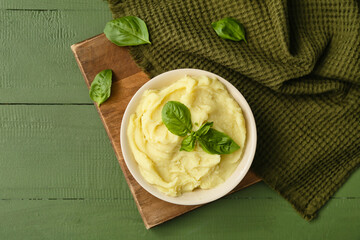 Composition with tasty mashed potatoes on color wooden background