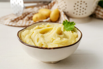 Bowl with tasty mashed potatoes on table