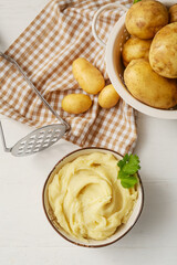 Composition with tasty mashed potatoes on light wooden background