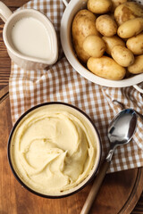 Composition with tasty mashed potatoes on wooden background