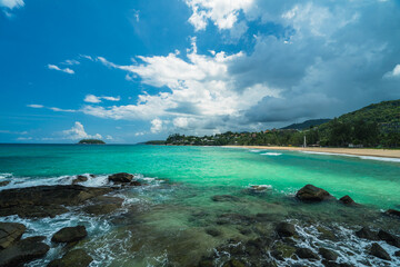 Fototapeta premium Tropical beach with stone in cloudy rainy weather. Summer vacation and nature travel adventure concept.. Summer composition.