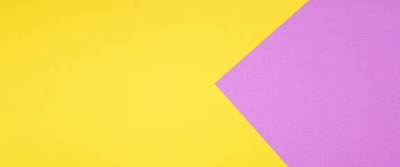yellow and pink two color paper background in web banner format