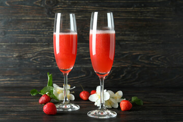 Concept of delicious drink with Rossini cocktail on rustic wooden table