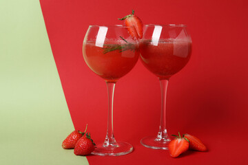 Alcoholic cocktail Rossini and ingredients on two tone background