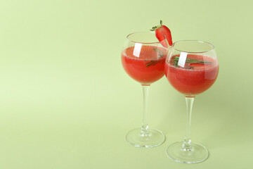 Alcoholic Rossini cocktails on light green background