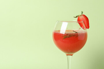 Alcoholic Rossini cocktail on light green background