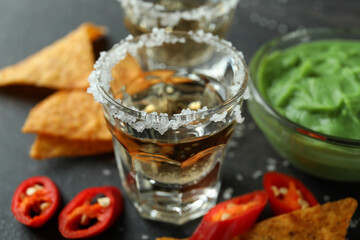 Party concept with tequila, guacamole and chips
