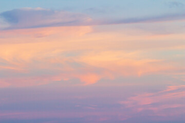 Sunset sky background with pink, purple and blue dramatic colorful clouds, vast sunset sky landscape