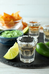 Party concept with tequila, guacamole and chips