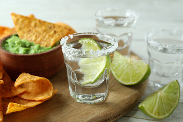 Party concept with tequila, guacamole and chips