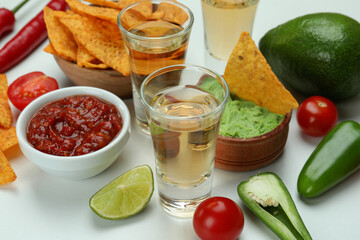 Party concept with tequila, guacamole and chips