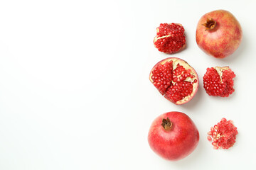 Ripe pomegranate on white background, space for text