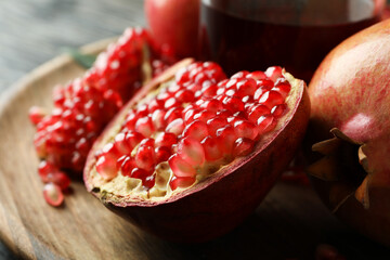 Glass of pomegranate juice and ingredients, close up