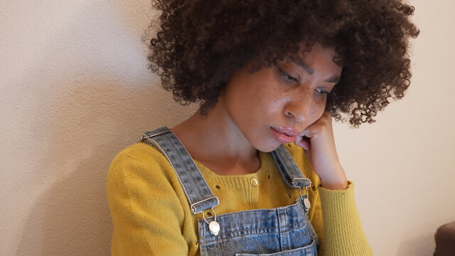 bored mix race girl studying