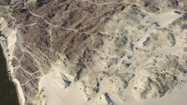 Aerial footage of water and dunes in Curonian Spit on Summer day. Lithuania