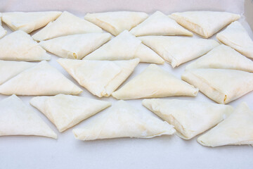 A ready-to-bake patty folded into a triangle.