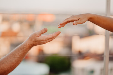 hand reach for each other. romantic relationships and family understanding. 