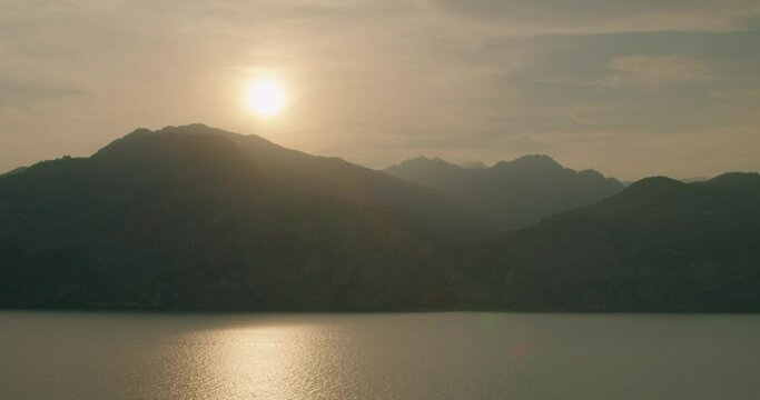 Time-lapse shot, Scenic view of sunset in Malcesine, looking towards lemone sul Garda on the lake Garda in Italy.
