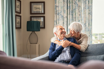 Senior couple hugging and having fun at home - Powered by Adobe