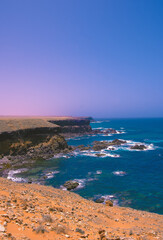 Fototapeta premium Ocean shore minimalist background. Ideal for postcard prints, phone cases, print t-shirts. Canary islands. Fuerteventura. Stylish nature visual spirits wallpaper