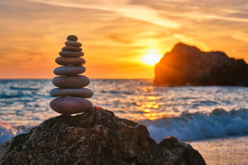 Concept of balance and harmony - stone stack on the beach