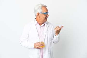 Middle age Brazilian scientific man scientific isolated on white background pointing to the side to present a product