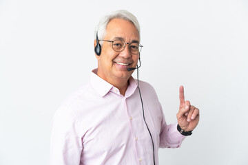 Telemarketer Middle age man working with a headset isolated on white background showing and lifting a finger in sign of the best