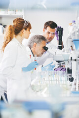 Health care researchers working in scientific laboratory.