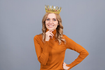 portrait of glory. smiling blonde woman in crown. self confident queen. expressing smug