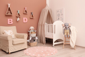 Baby room interior with stylish furniture and comfortable crib © New Africa