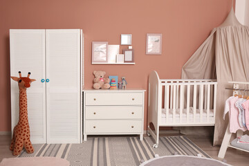 Baby room interior with stylish furniture and comfortable crib © New Africa