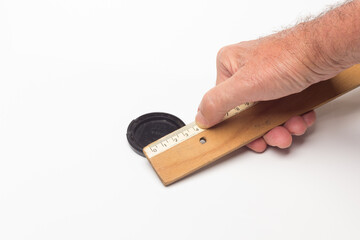 Classic wooden ruler for taking measurements.
