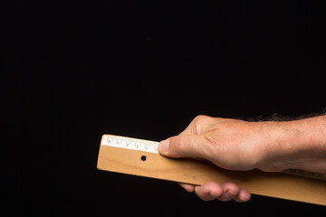 Classic wooden ruler for taking measurements.
