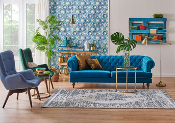 Blue wallpaper and sofa furniture style, decorative wooden palette bookshelf, gold lamp and middle table, vase of green plant, carpet and city view background.